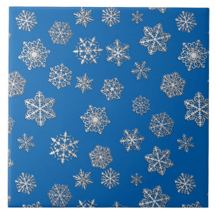 Silver snowflakes on a cobalt blue background tile