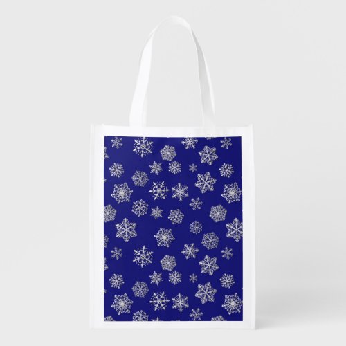 Silver snowflakes on a dark blue background reusable grocery bag