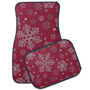 Silver snowflakes on dark red car floor mat