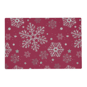 Silver snowflakes on dark red placemat