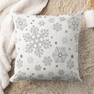 Silver snowflakes on white throw pillow