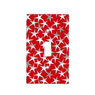 Silver stars on dark red light switch cover