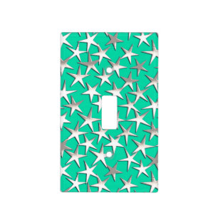 Silver stars on turquoise light switch cover