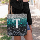 Silver Teal Black Gradient Chunky Glitter Monogram Tote Bag<br><div class="desc">A modern bold single letter double layer text monogram in white with a black drop shadow. The font size, color and style are customizable. The background is a faux chunky glitter in a silver, teal and black ombre with sparkly and bokeh blur spots. Move or delete the faux sparkle graphic...</div>