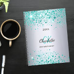 Silver teal glitter name monogram 2024 planner<br><div class="desc">A faux silver metallic looking background decorated with teal,  sea green faux glitter dust. Personalize and add your first name,  monogram initials,  full name and a year.</div>