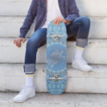 "Silver Turtle Radiance" | Coastal  Skateboard<br><div class="desc">This coastal artwork features a silver sea turtle in the center of a geometric mandala on a blue background.</div>