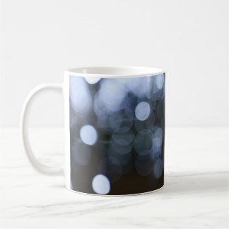 Silver, white bokeh night background. coffee mug