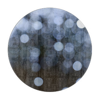 Silver, white bokeh night background. cutting board