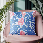 Simple and Abstract Mostera Pink and Blue Pattern Throw Pillow<br><div class="desc">Introducing a modern and abstract cushion cover, featuring a bold botanical pattern that effortlessly blends simplicity with sophistication. The design showcases oversized Monstera leaves in striking shades of blue and soft pink, creating a contemporary yet calming visual appeal. Perfect for adding a touch of nature-inspired elegance to any room, this...</div>