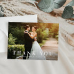 simple bold text wedding thank you card<br><div class="desc">an elegant yet simple white text design with a bold text look and a lovely image of the bride and groom,  the text and colors can be personalized.</div>