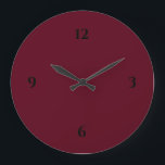 Simple Burgundy Wine & Black Large Clock<br><div class="desc">Modern clock features a minimalist design in a burgundy color palette with black accents. A simple plain design with black numbers on a burgundy wine colored background. A trendy addition to your kitchen, living room or office wall, a thoughtful modern office gift or modern home gift for any occasion. You...</div>
