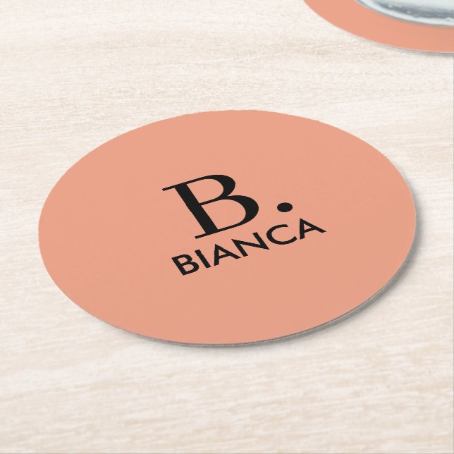 Simple coral pink minimalist monogram round paper coaster (Angled)