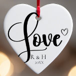 Simple Elegant Minimalist Personalized Christmas Ceramic Ornament<br><div class="desc">Introducing our Simple Elegant Minimalist Personalized Christmas Ceramic Ornament. This black and white design embodies the essence of a clean and simple, minimalist Christmas. It's the perfect choice for celebrating various occasions, from a first Christmas engaged to a thoughtful anniversary present for a husband and wife. Customized with your names...</div>