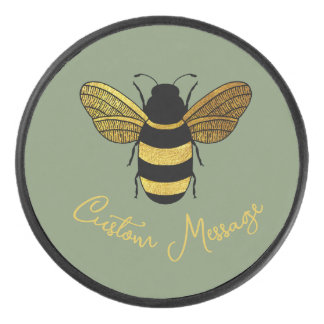 SIMPLE GOLD BLACK BUZZY BEE MESSAGE ON SAGE GREEN HOCKEY PUCK