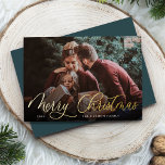 Simple Gold Script Overlay Merry Christmas Photo Foil Holiday Card<br><div class="desc">Elegant Christmas photo card features a single horizontal or landscape-oriented photo with "Merry Christmas" overlaid in gold foil calligraphy script lettering. Personalize with your family name or individual names and the year beneath in modern white lettering. A simple and chic choice for your holiday greetings.</div>