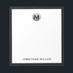 Simple Luxury Monogram Black and Silver Notepad<br><div class="desc">Elevate your note-taking game with this simple yet luxurious notepad featuring a striking black and silver color scheme. The design showcases a classic monogram in bold block typography, personalized with your initial. Perfect for jotting down notes, ideas, or daily tasks, this notepad is a must-have accessory for any busy professional...</div>