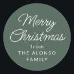 Simple Merry Christmas from green holiday gift Classic Round Sticker<br><div class="desc">This simple green Christmas present label features an editable classic script Merry Christmas along with a from in simple white type. This festive holiday gift sticker is designed to coordinate with the Lea Delaveris Design Home for the Holidays collection but works well with a variety of other designs. Use it...</div>