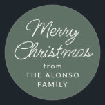 Simple Merry Christmas from green holiday gift Classic Round Sticker<br><div class="desc">This simple green Christmas present label features an editable classic script Merry Christmas along with a from in simple white type. This festive holiday gift sticker is designed to coordinate with the Lea Delaveris Design Home for the Holidays collection but works well with a variety of other designs. Use it...</div>