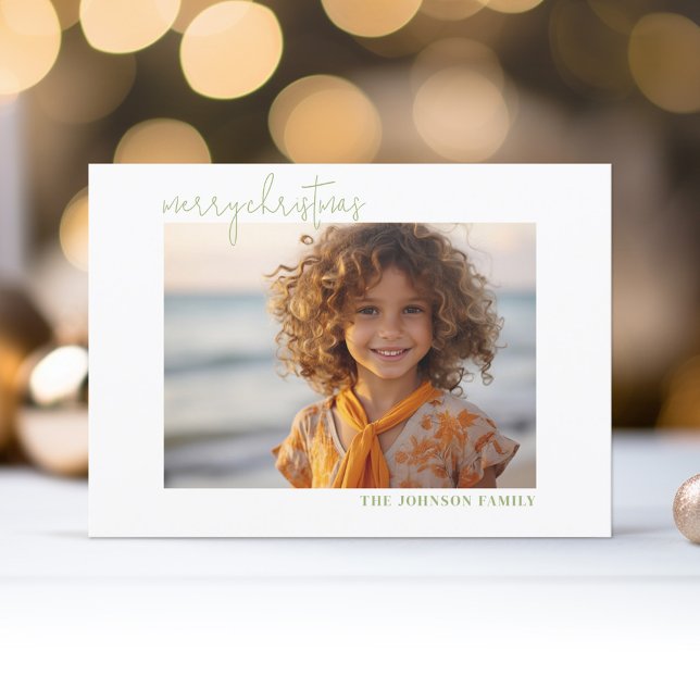 Simple Minimal Photo Merry Christmas Script Holiday Card (A modern, minimal photo card design with one photo on the front with a classy white gallery border.)