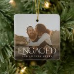 Simple Modern Elegant Engaged 2 Photo Christmas Ceramic Ornament<br><div class="desc">This stylish photo Christmas ornament boasts modern typography, reading, "ENGAGED" (AND SO VERY MERRY). It contains separate photo templates for the back and the front, as well as text templates on the back for names and year. What a perfect way to celebrate your first Christmas together as an engaged couple!...</div>