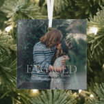 Simple Modern Elegant Engaged Photo | Christmas Glass Ornament<br><div class="desc">This simple and sweet ornament says "Engaged" in trendy, modern typefaces with a quote and a spot for the year & names. Minimal one photo template of your favorite personal photo for a gift anyone would love. What a perfect way to celebrate your first Christmas together as an engaged couple!...</div>