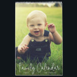 Simple Modern Elegant Script Family Photo Calendar<br><div class="desc">Modern single page calendar featuring a simple cover design with the words, "Family Calendar" in an elegant thin white script, along with your family name and the year over your favorite vertical photo. Each month has a single full bleed picture of your choice. This custom calendar is great to keep...</div>