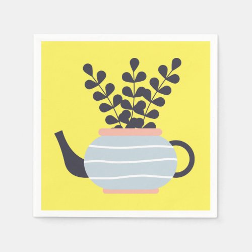 Simple modern teapot with plant pastel napkins