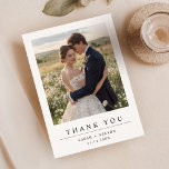 Simple Modern Wedding Photo Thank You Card<br><div class="desc">This Simple Modern Wedding Photo Thank You Card features a romantic outdoor setting with the couple embraced in a field of flowers on the front,  and a serene sunset landscape on the back. The design is elegant and personal,  combining beautiful photography with a simple,  clean typography layout</div>