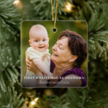 Simple Photo First Christmas as Grandma Ceramic Ornament<br><div class="desc">Celebrate her first christmas as grandma with this simple photo christmas tree ornament. This 2 sided ornament can be customized with a photo and any text of your choice. Grandma can be changed to "Grammy" or "Nana" or any name of your choice. This will be the perfect christmas keepsake to...</div>
