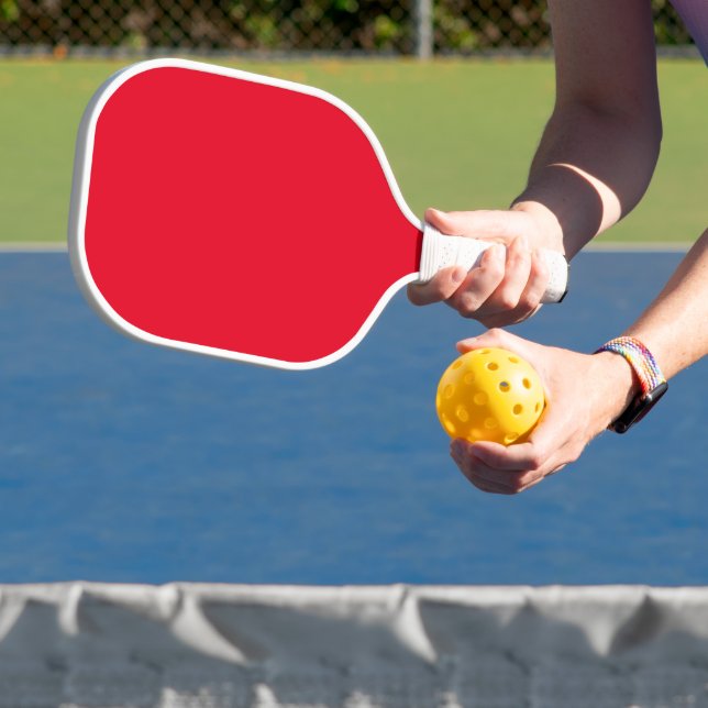 Simple plain red pickleball paddle (Insitu)
