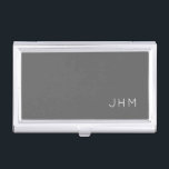 Simple Professional Gray Classic Monogram Business Card Case<br><div class="desc">Professional business card holder features sleek simple minimalist design in a gray color palette with white accents. Custom monogram initials presented on a simple grey background; positioned lower right hand corner. Shown with personalized monogram initials in a simple classic modern font, this executive business card holder is designed as a...</div>