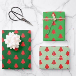 Simple Red Christmas Trees on Green Wrapping Paper Sheets