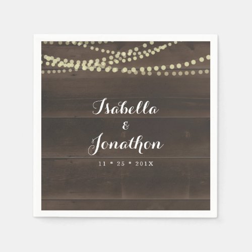 Simple Rustic Wedding Napkins - Add some elegance to your wedding or special occasion with napkins personalized with your names and the special date.  The design, a dark wood background with fairy lights strung above beautiful script, would make a great addition to your barn chic themed event.