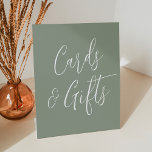 Simple Script Sage Green Wedding Cards and Gifts Pedestal Sign<br><div class="desc">Simple and elegant wedding pedestal sign featuring the phrase "Cards and Gifts" displayed in white script with a sage green background. Personalize the sign with optional custom text such as your names, wedding date, thank you message, etc. The sign can also be used for other events such as bridal showers,...</div>