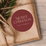 Simple Stylish Merry Christmas | Name | Red Classic Round Sticker<br><div class="desc">These stylish Christmas stickers feature simple,  stylish typography reading,  "Merry Christmas" in ivory. A text template is included for easy personalization. The background color (burgundy red) can be customized to any color you'd like. Great for envelope seals,  gift tag stickers,  party favor stickers,  and more!</div>