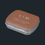 Simple Terracotta Monogram Elegant Wedding Candy Tin<br><div class="desc">Simple terracotta wedding mint candy tin featuring a modern yet elegant design with your two letter monogram along with your names and date in white over a burnt orange / rust background. The font and background colors may be changed to any colors you wish by clicking the "customize" button. These...</div>
