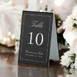 Simply Elegant Wedding Table Number Table Tent Sign<br><div class="desc">A simple elegant table number design in classic black with white text. The easy-to-use text template has the table number along with the Bride and Groom's names and wedding date. To create a table number sign for each of your tables, edit the table number along with the names and date,...</div>