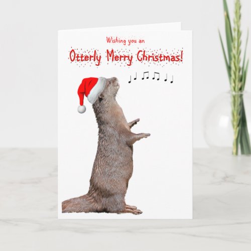 Singing otter with santa hat Folded Greeting Card