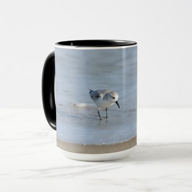 Single Sandpiper walking on beach  Mug (Front Left)