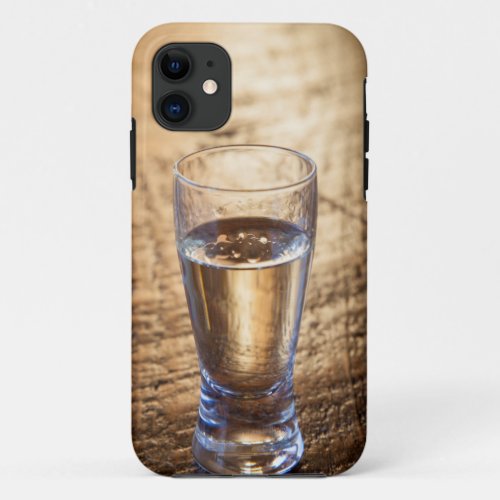 Single shot of Tequila on wood table iPhone 11 Case