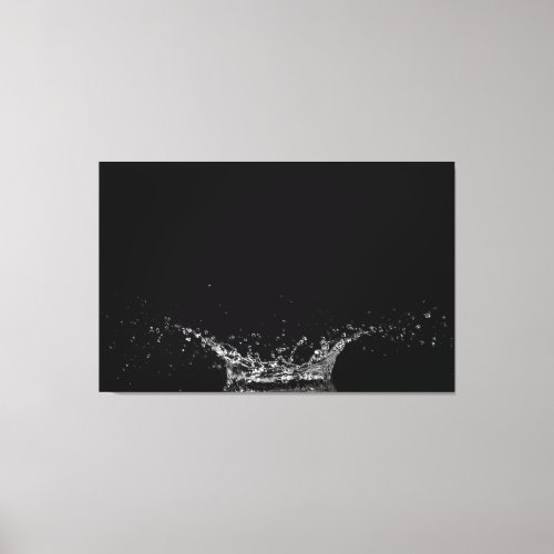 Single water splash on a black background canvas print