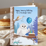 Sister Happy January Birthday Snowy Owl Card<br><div class="desc">This charming January birthday card features a beautiful Snowy Owl holding a snowflake balloon beside a rich chocolate birthday cake, creating a fun and cozy winter scene just right for your sister. In the background, a small Barn Owl peeks out from the snowy setting, adding a playful touch of nature...</div>