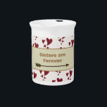 Sisters are Forever Vibrant Heart Pattern Sibling Beverage Pitcher<br><div class="desc">Are you looking for a special gift item for your sister? This small milk or beverage pitcher features a pattern of vibrant red painted hearts along with a golden arrow that supports the words "Sisters are Forever". The design of multi-sized hearts wraps around the mug in a pattern and the...</div>