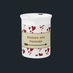 Sisters are Forever Vibrant Heart Pattern Sibling Beverage Pitcher<br><div class="desc">Are you looking for a special gift item for your sister? This small milk or beverage pitcher features a pattern of vibrant red painted hearts along with a golden arrow that supports the words "Sisters are Forever". The design of multi-sized hearts wraps around the mug in a pattern and the...</div>