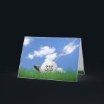 Sister's birthday golf ball in grass card<br><div class="desc">White golf ball in green grass with golf club and sky background for sister's birthday.</div>