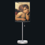 Sistine Madonna Angels by Raphael Sanzio Table Lamp<br><div class="desc">Sistine Madonna (detail) (c. 1512-1514). Artist: Raphael Sanzio (1483-1520) or simply Raphael or Raffaello. Sistine Madonna (detail) is a vintage Renaissance fine art religious portrait painting featuring two angels looking upwards towards the clouds and the heavens.</div>