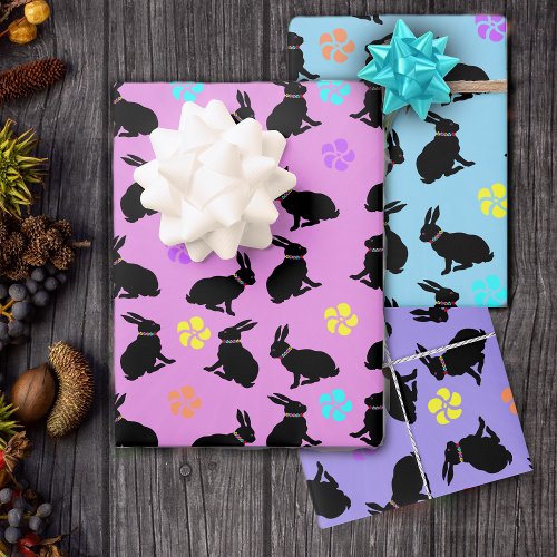 Sitting Black Bunnies Wearing Flowers on Pastels Wrapping Paper Sheets