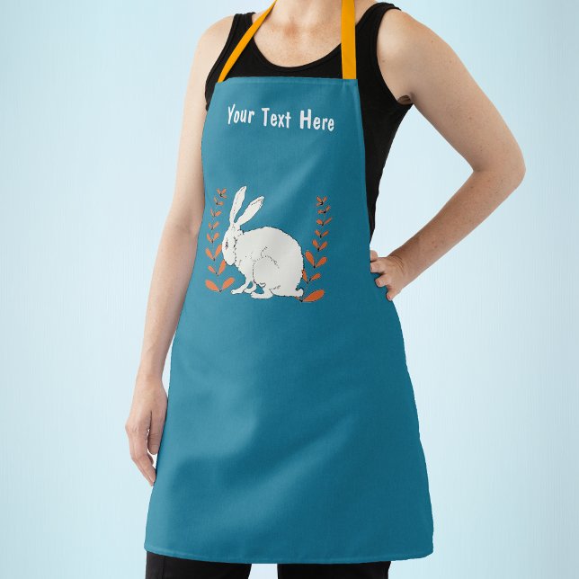Sitting White Rabbit Orange Flower Plants on Blue Apron (White sitting rabbit with orange flowers on dark blue kitchen apron.)