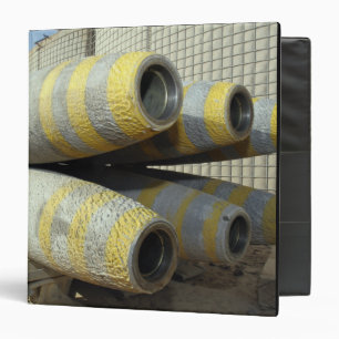 Six GBU-12 bombs sit in a rack Binder