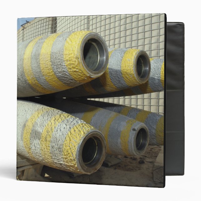 Six GBU-12 bombs sit in a rack Binder (Front/Inside)